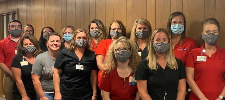 group of women wearing masks